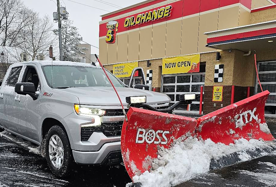 Fox crew snow plowing a commercial parking lot in Montgomery County PA