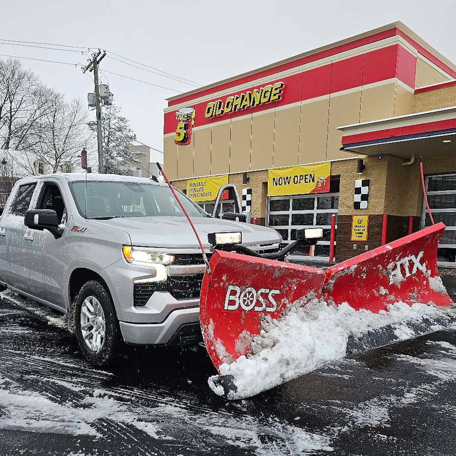 Fox crew snow plowing a commercial parking lot in Montgomery County PA